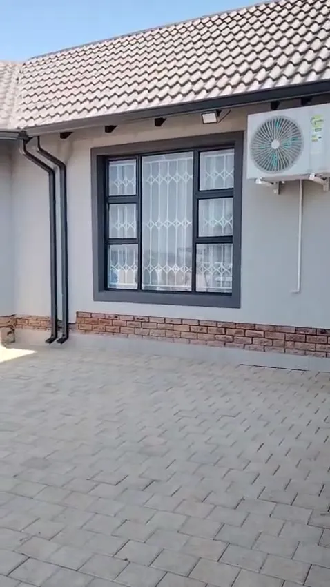 Single-storey home with charcoal seamless gutters and matching charcoal downpipes
